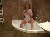 Blonde Plays With The Shower Head