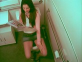 Office babe gets caught on cam reading a sex book and masturbating